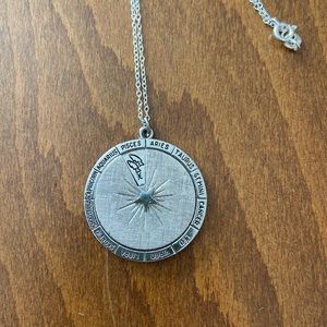 Silver tone horoscope pendant on 18” sterling chain. Rotate 12 signs & symbols.